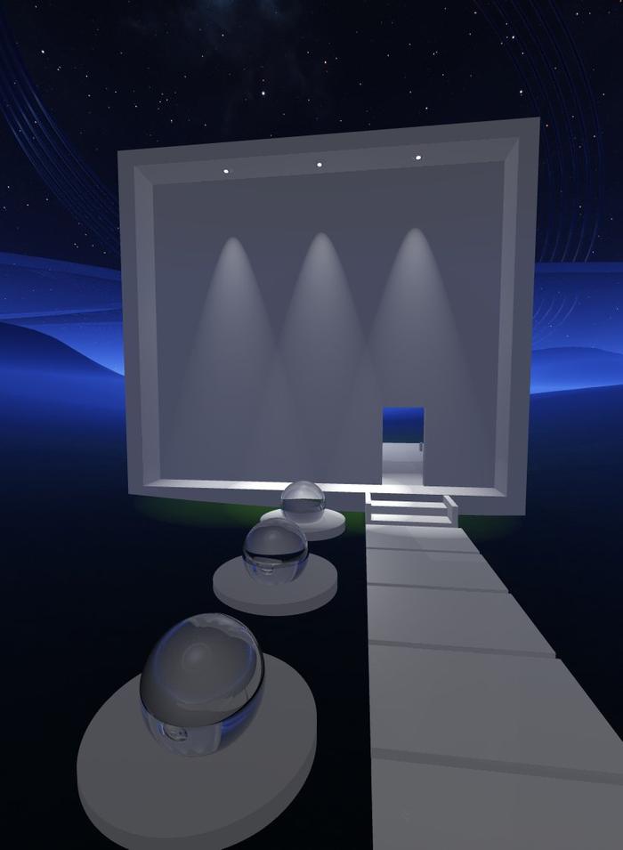 White gallery structure with glass spheres at night